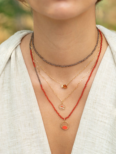 Mediterranean Sunset pendant with diamonds worn on a fine gold chain